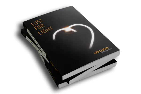 Mockup of the corporate design book “Lust for Light” by LED Linear, featuring a black cover and a glowing heart shape